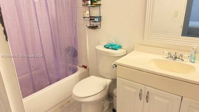 17570 Atlantic Boulevard, #105, Sunny Isles Beach, Sunny Isles Beach, FL 33160 Bathroom featuring a bathtub with tile surround, a white vanity with an integrated countertop and sink, polished metal faucet hardware, and a framed wall mirror