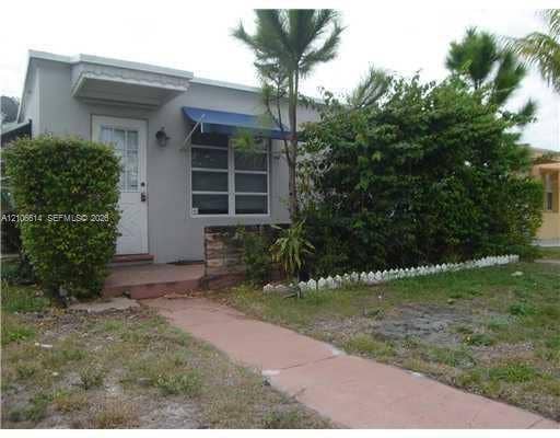 Front exterior from prior 2011 listing; appearance may have changed.