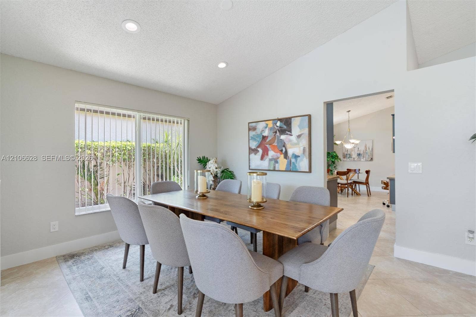 7259 Via Palomar, Boca Raton, FL 33433 Vaulted ceilings, large window with vertical blinds, recessed lighting, and tile flooring