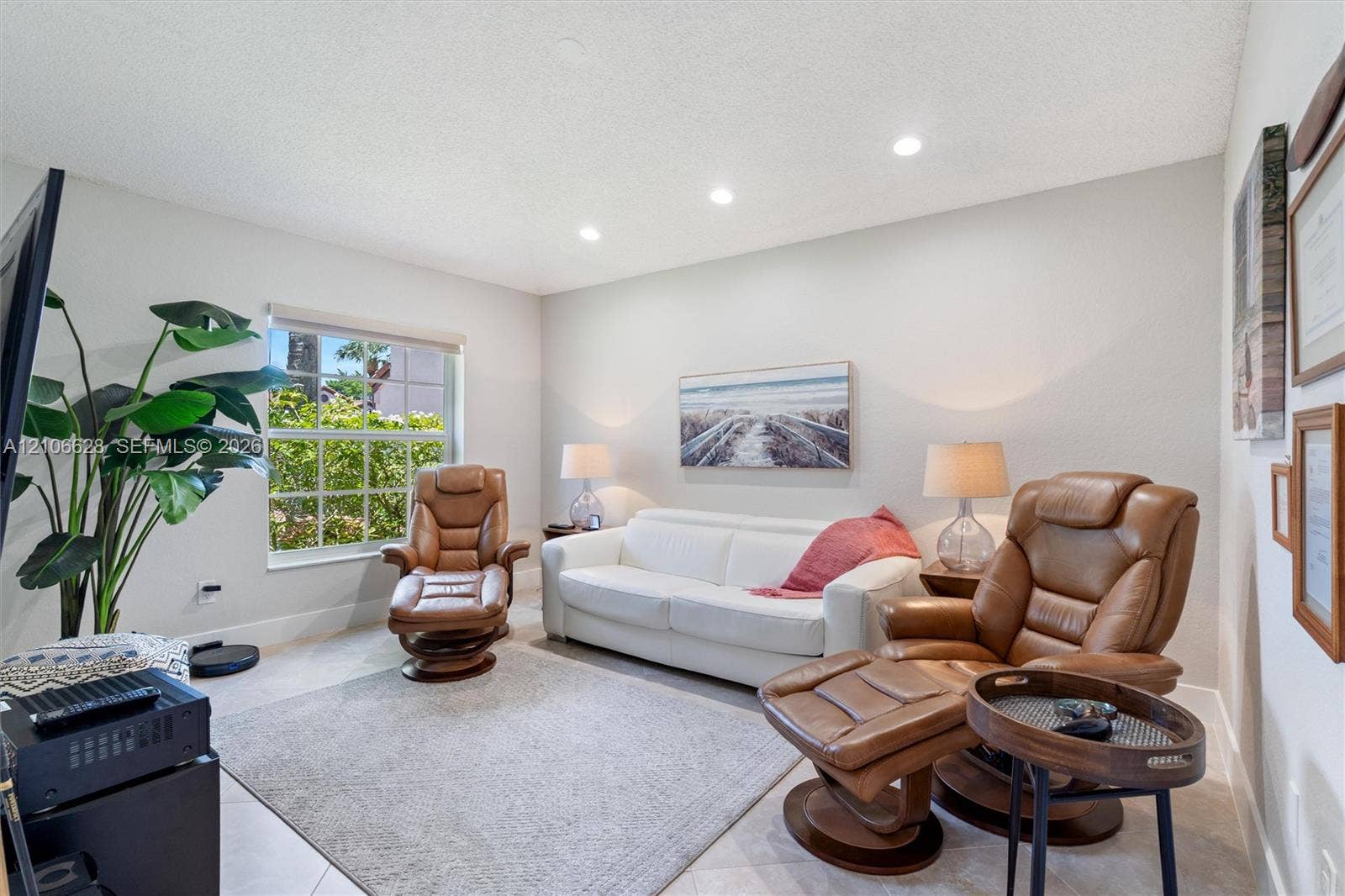 7259 Via Palomar, Boca Raton, FL 33433 Neutral wall-toned room featuring recessed lighting, tile flooring, and a large multi-pane window