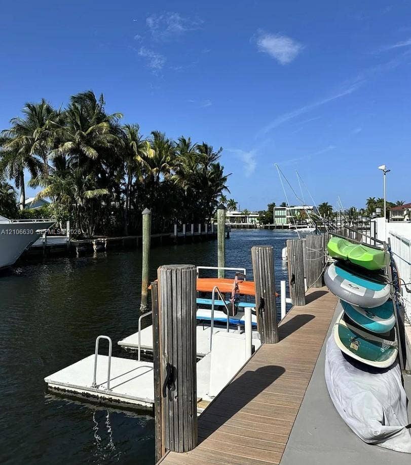 Private deep-water dock featuring wooden decking, multiple pilings, and integrated floating platforms