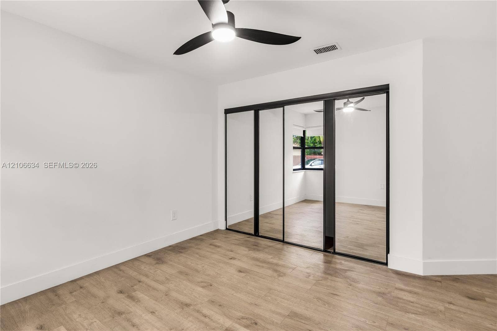 Second bedroom - mirrored closet sliding doors