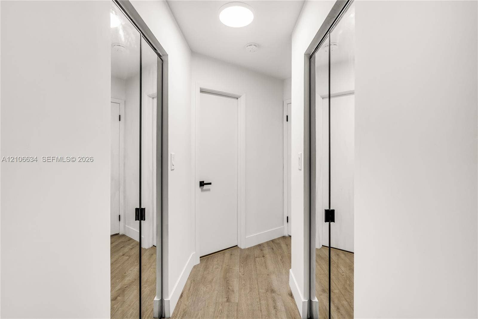 Two walk-in closets at entry way of Primary Bedroom