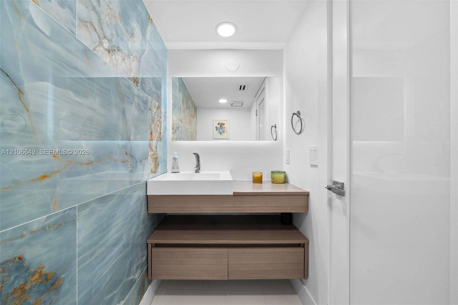 216 Poinciana Drive, #206, Sunny Isles Beach, FL 33160 Open-concept floor plan with polished tile flooring and recessed ceiling lighting