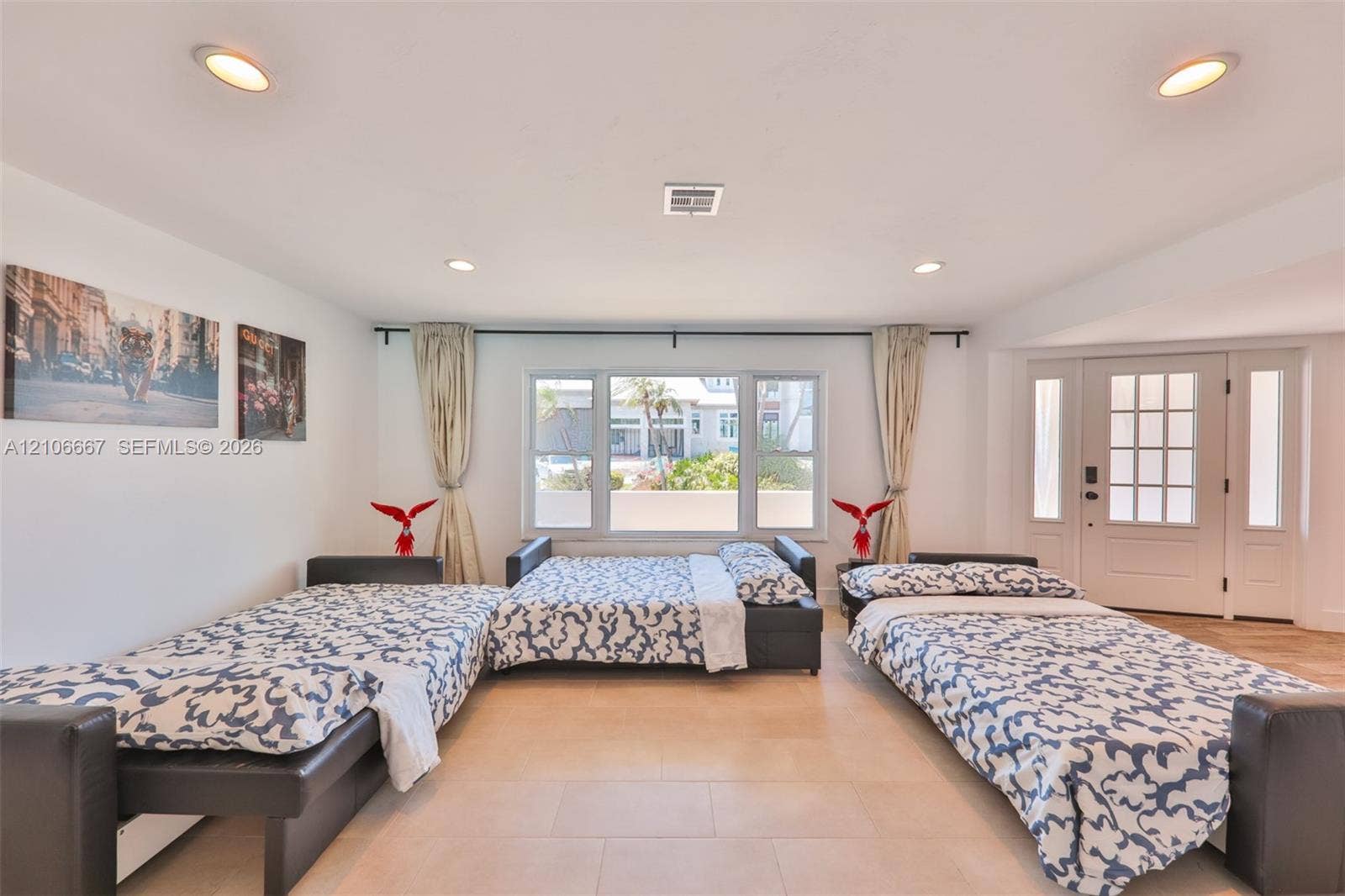 209 Bayshore Drive, Cape Coral, FL 33904 Large-format tile flooring, recessed ceiling lighting, and a multi-pane entry door with sidelights