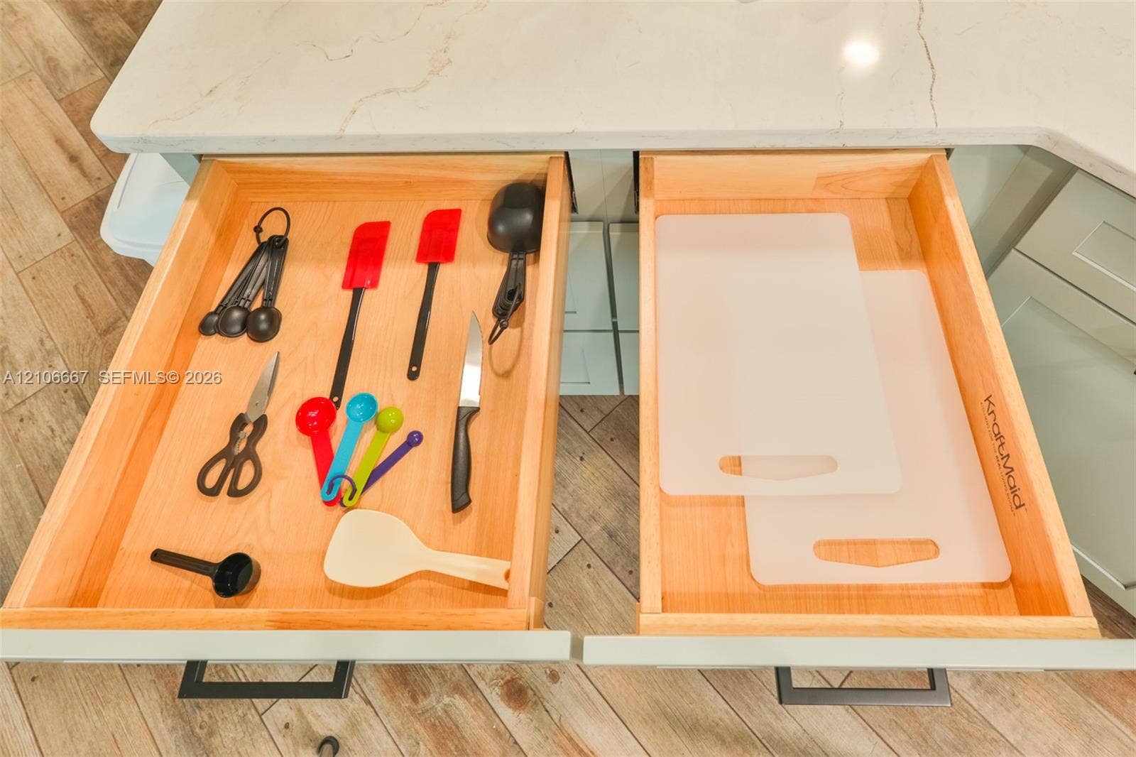 209 Bayshore Drive, Cape Coral, FL 33904 Custom wood-dovetail cabinetry drawers with stone countertops, undermount hardware, and integrated pulls