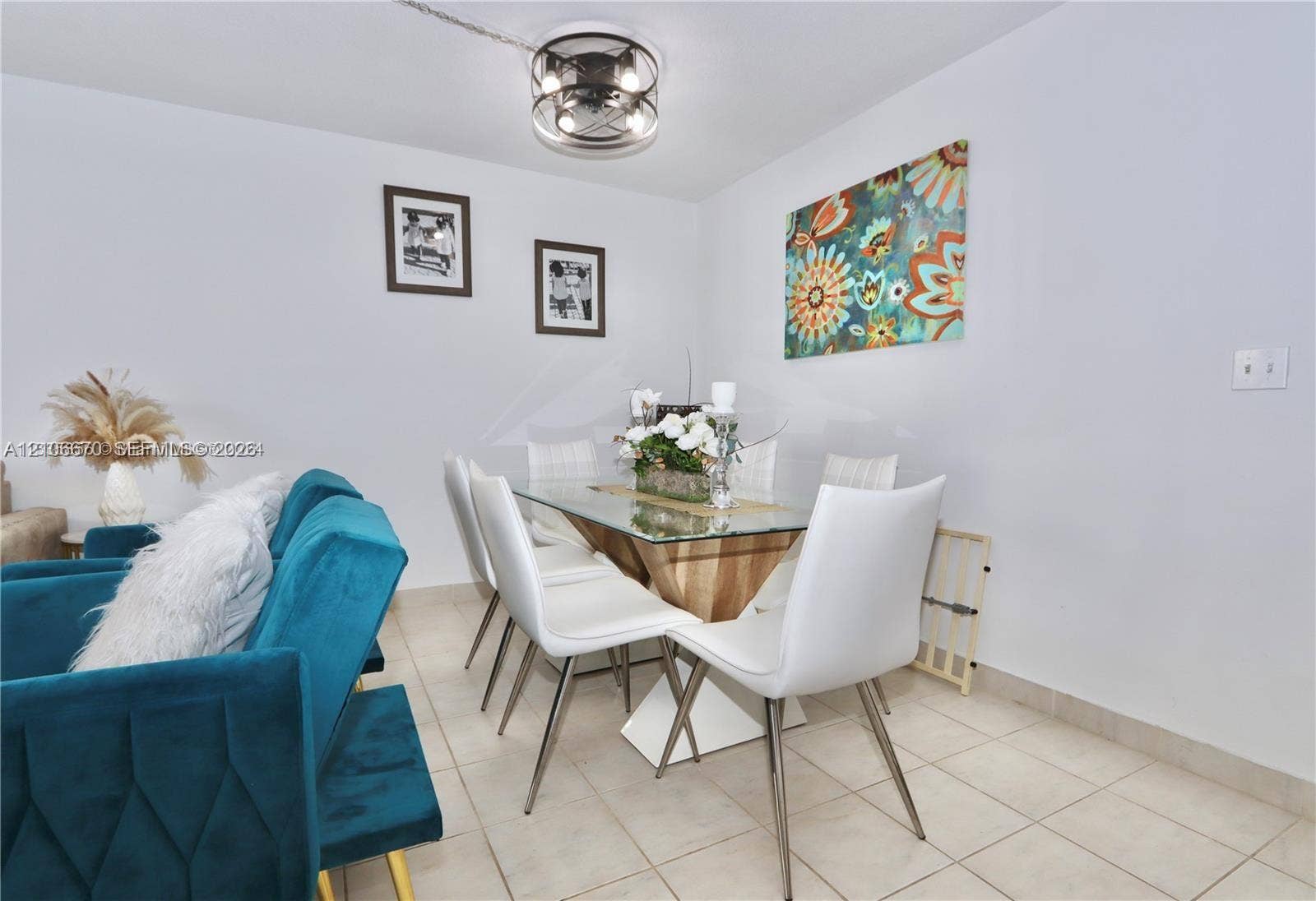 3030 Marcos Drive, #T512, Aventura, FL 33160 Tile flooring and industrial-style metal drum ceiling light fixture