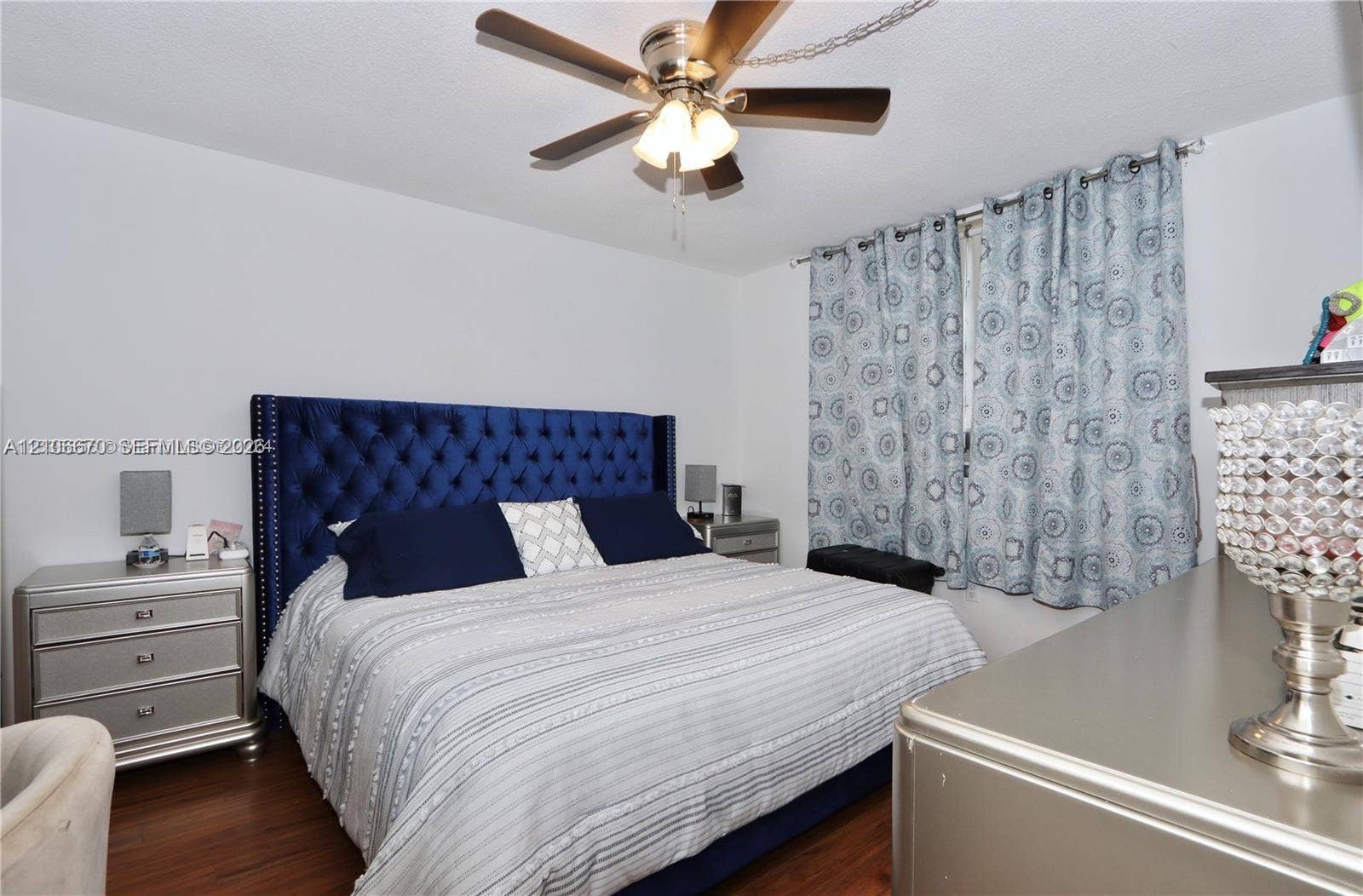 3030 Marcos Drive, #T512, Aventura, FL 33160 Wood-finish flooring and a ceiling fan with integrated lighting