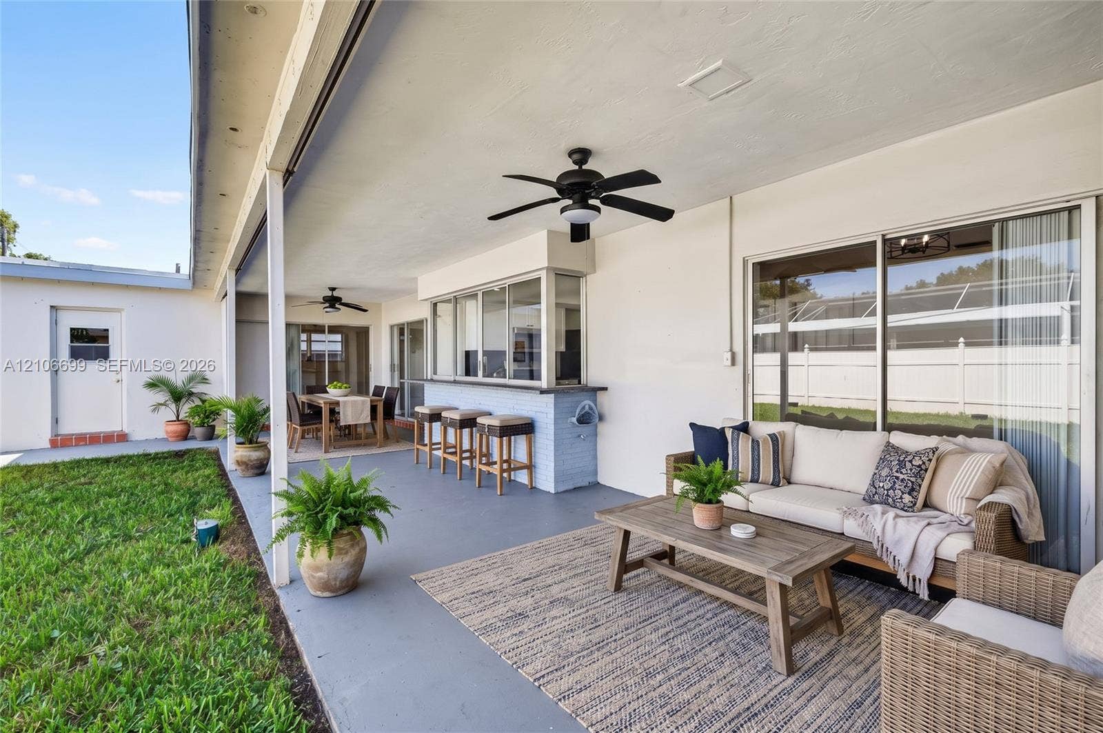 9121 SW 54th Place, Cooper City, FL 33328 Backyard w/ covered patio & fans