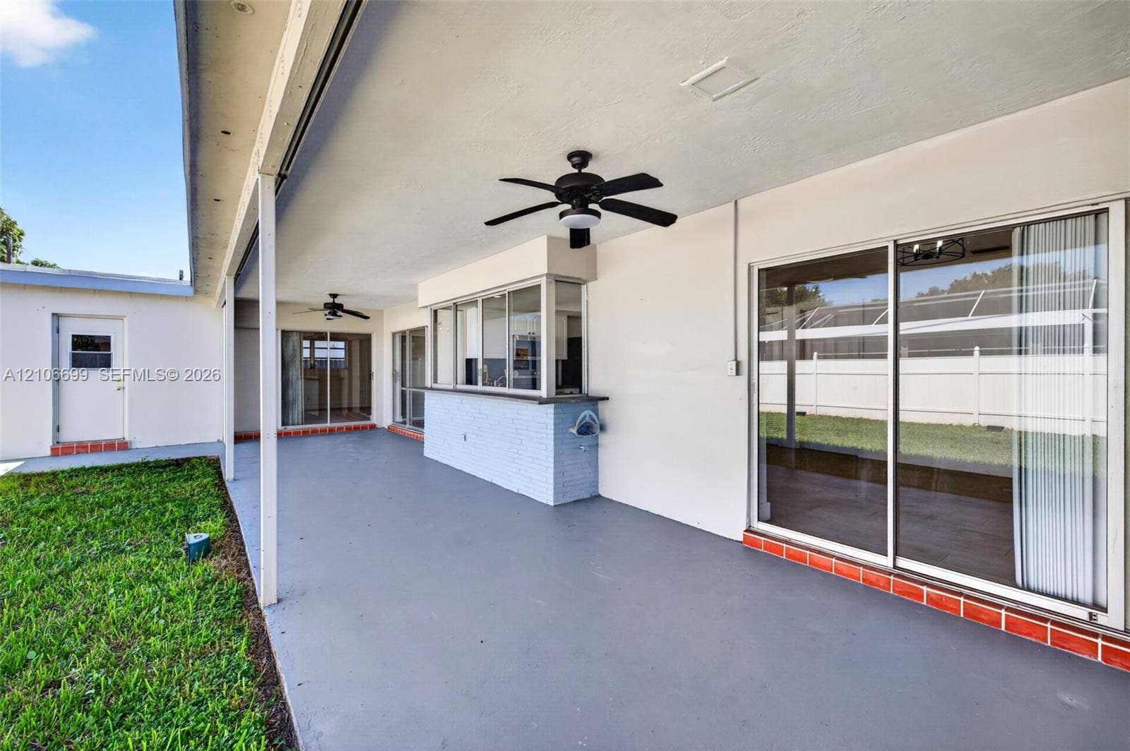 9121 SW 54th Place, Cooper City, FL 33328 Backyard w/ covered patio & fans