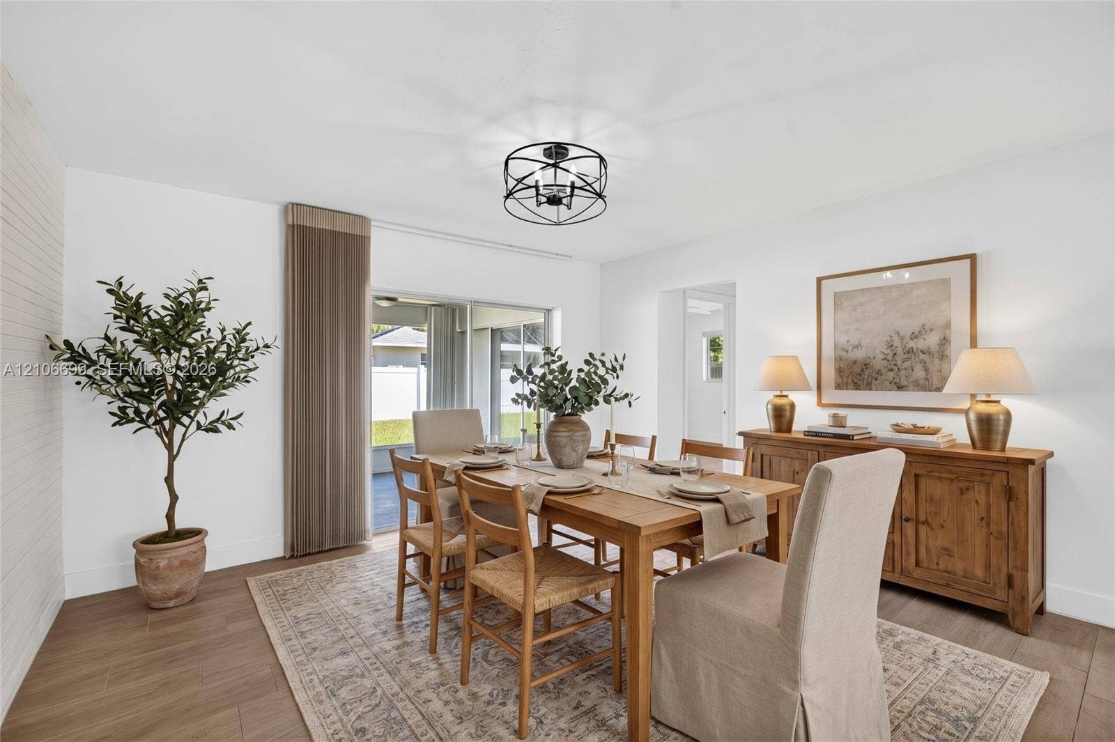 9121 SW 54th Place, Cooper City, FL 33328 Dining area overlooking backyard w/ new plank wood look tile