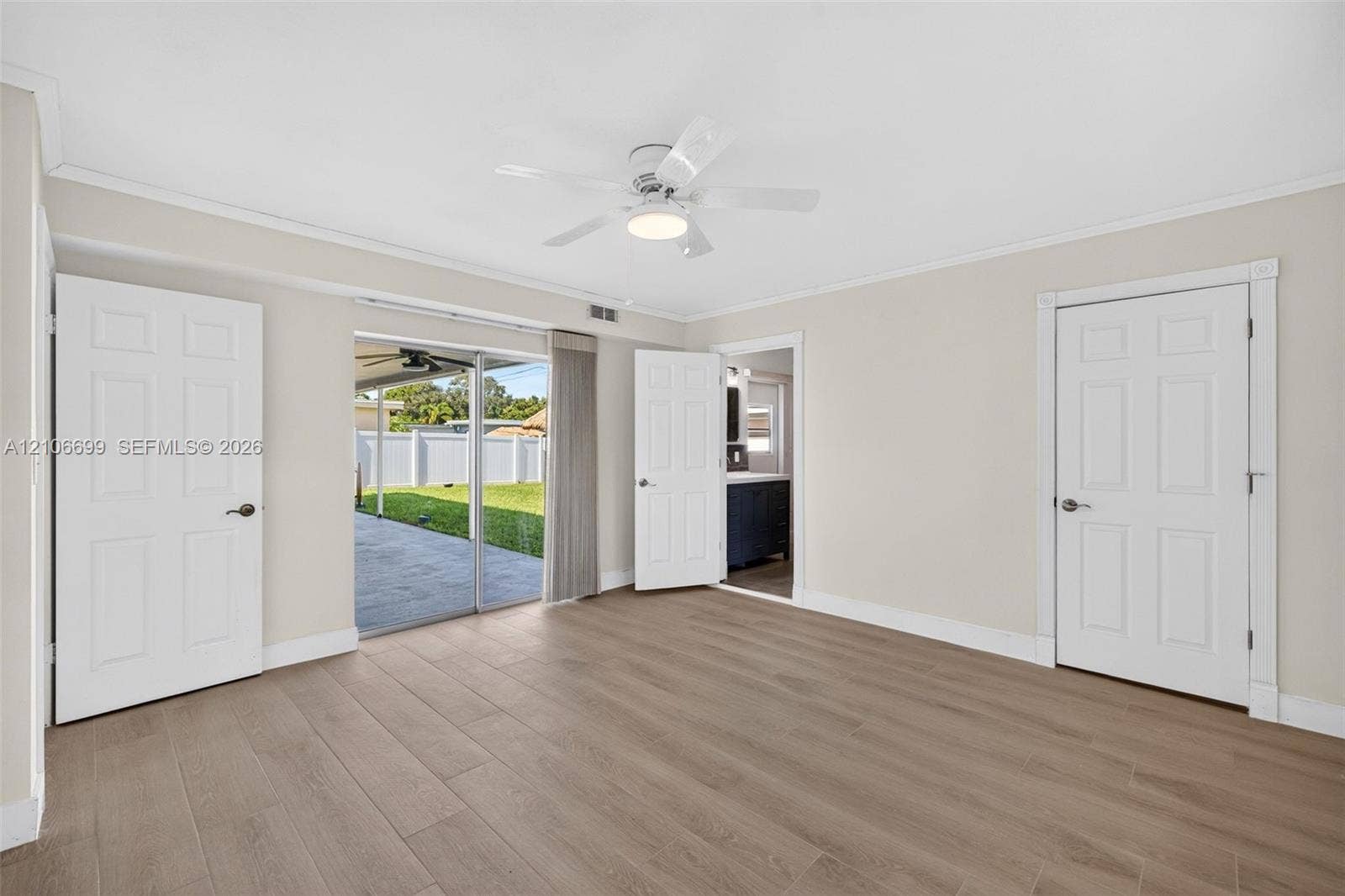 9121 SW 54th Place, Cooper City, FL 33328 Primary bedroom w/ new plank wood look tile