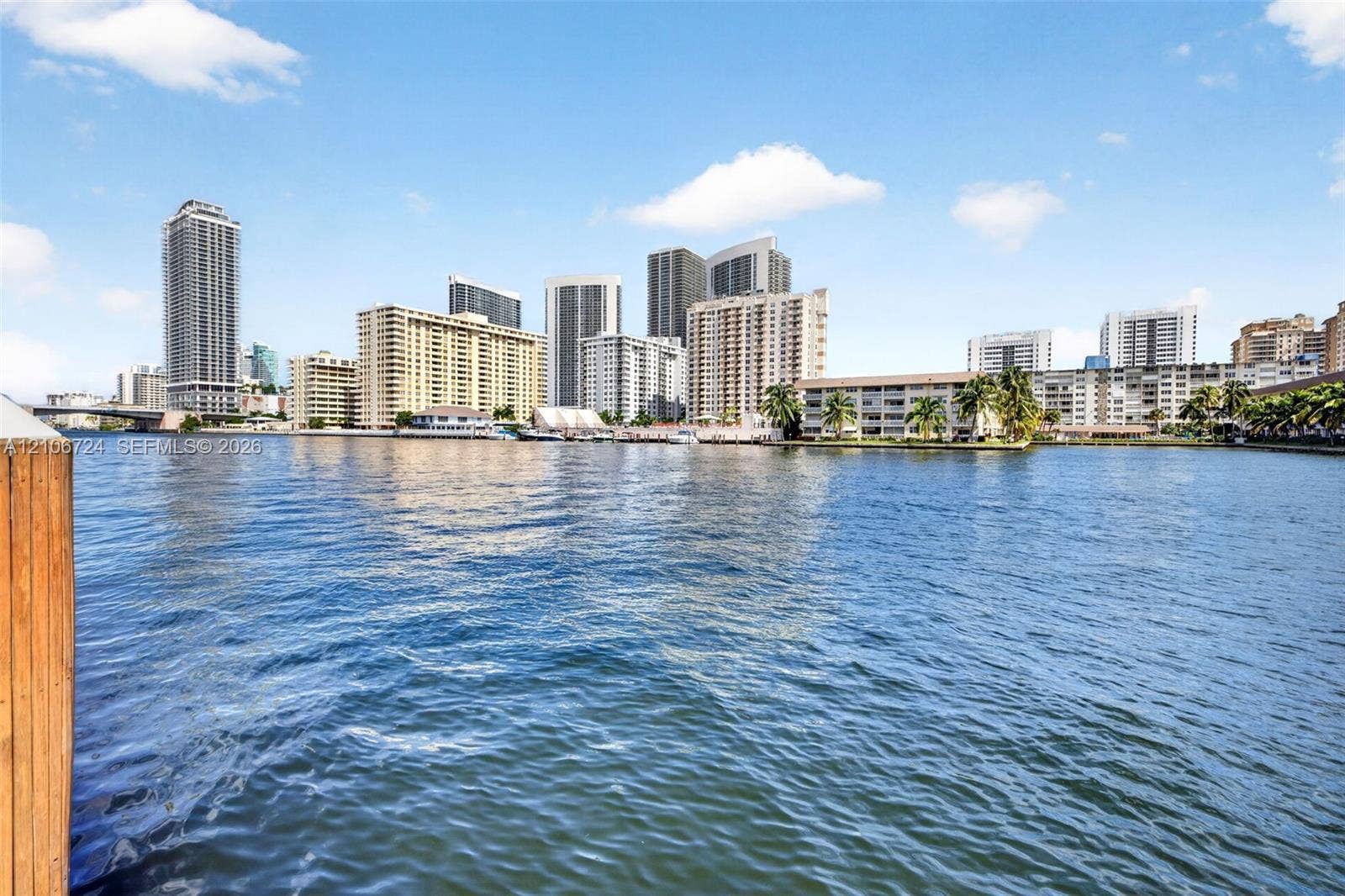 111 Golden Isles Drive, #G12, Hallandale Beach, FL 33009 Waterfront property featuring a wooden bulkhead and expansive waterway frontage