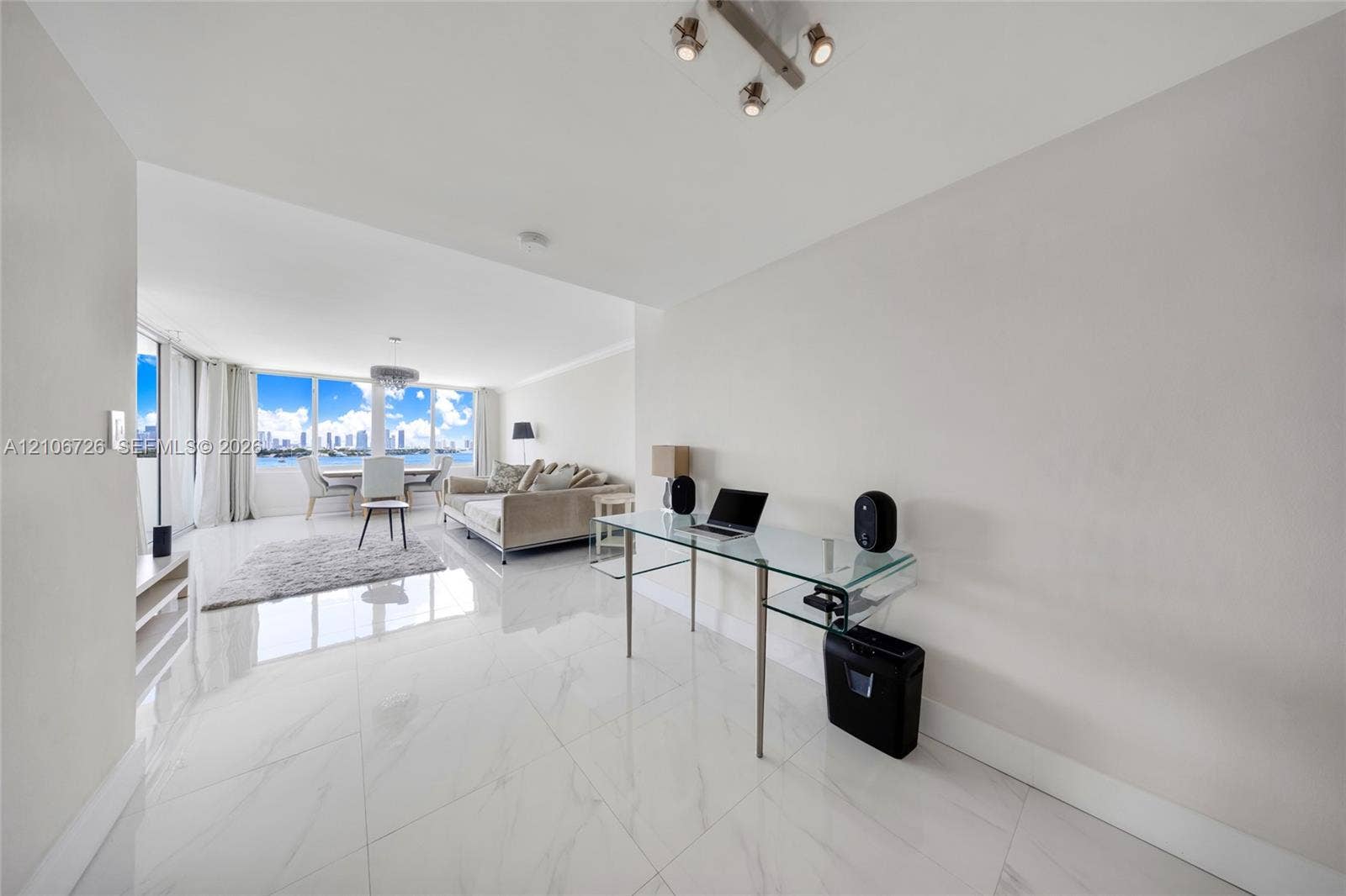 1200 West Avenue, #606, Miami Beach, Miami Beach, FL 33139 Large-format stone-style tile flooring, floor-to-ceiling windows, and multi-directional overhead track lighting