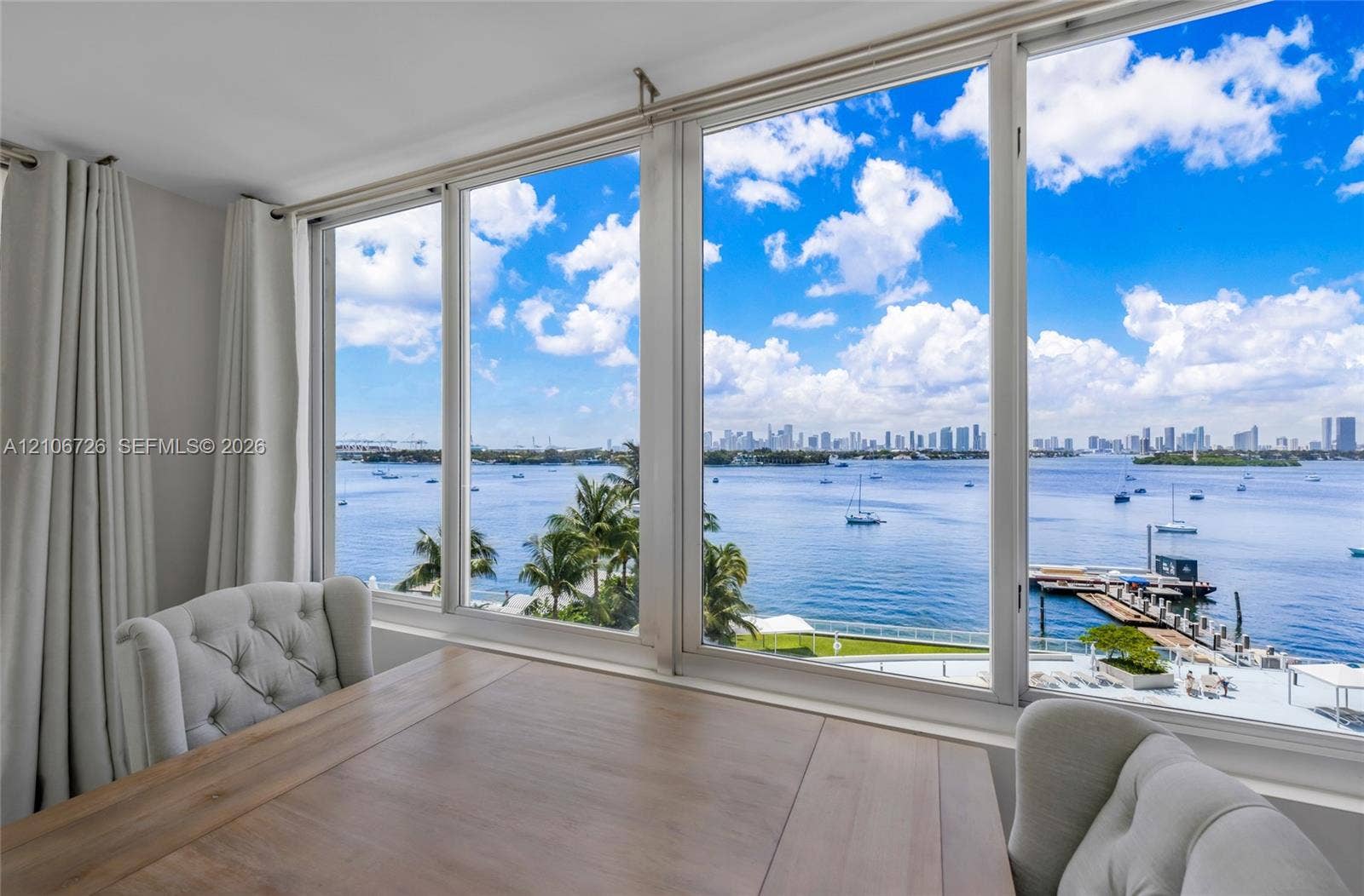 1200 West Avenue, #606, Miami Beach, Miami Beach, FL 33139 Floor-to-ceiling windows featuring panoramic water and city skyline horizons