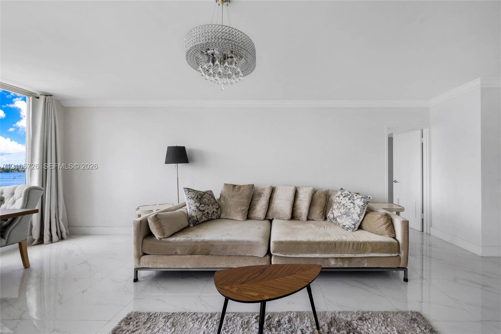 1200 West Avenue, #606, Miami Beach, Miami Beach, FL 33139 Polished stone flooring, crystal-accented chandelier, and expansive glass paneled window