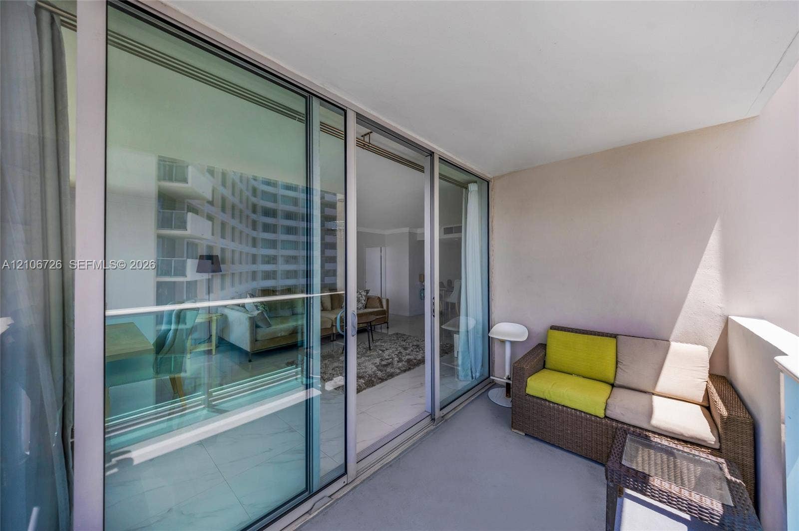 1200 West Avenue, #606, Miami Beach, Miami Beach, FL 33139 Covered balcony featuring glass sliding doors and neutral wall finishes