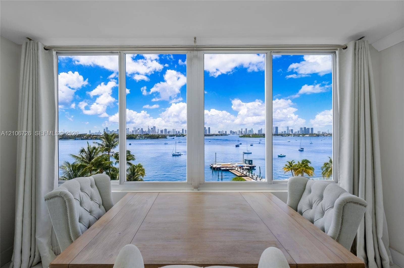 1200 West Avenue, #606, Miami Beach, Miami Beach, FL 33139 Large format picture windows featuring expansive water, marina, and skyline scenes