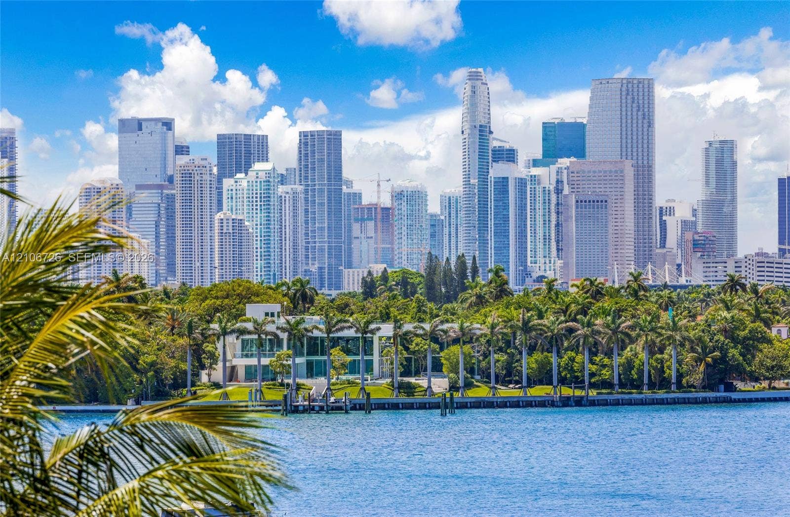 1200 West Avenue, #606, Miami Beach, Miami Beach, FL 33139 Waterfront estate featuring floor-to-ceiling glass windows, a private dock, and mature perimeter landscaping