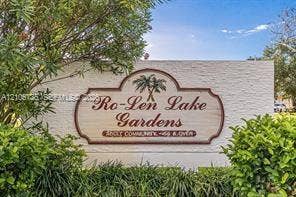 1000 SW 11 Avenue, #12, Hallandale Beach, Hallandale Beach, FL 33009 Community entrance monument featuring textured masonry signage and mature perimeter landscaping