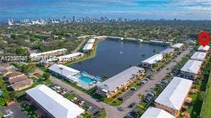 1000 SW 11 Avenue, #12, Hallandale Beach, Hallandale Beach, FL 33009 Aerial perspective of multi-family residential complex featuring a central lake, swimming pool, and paved surface parking