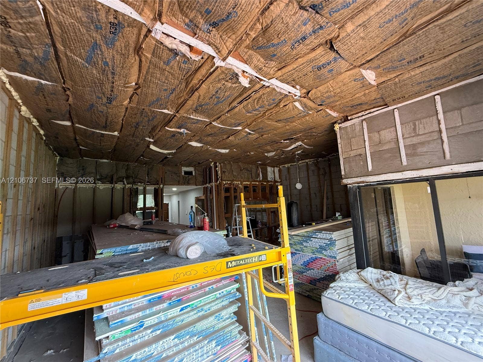 5225 Monterey Circle, #G, Delray Beach, FL 33484 Interior space featuring exposed wood framing and installed ceiling insulation