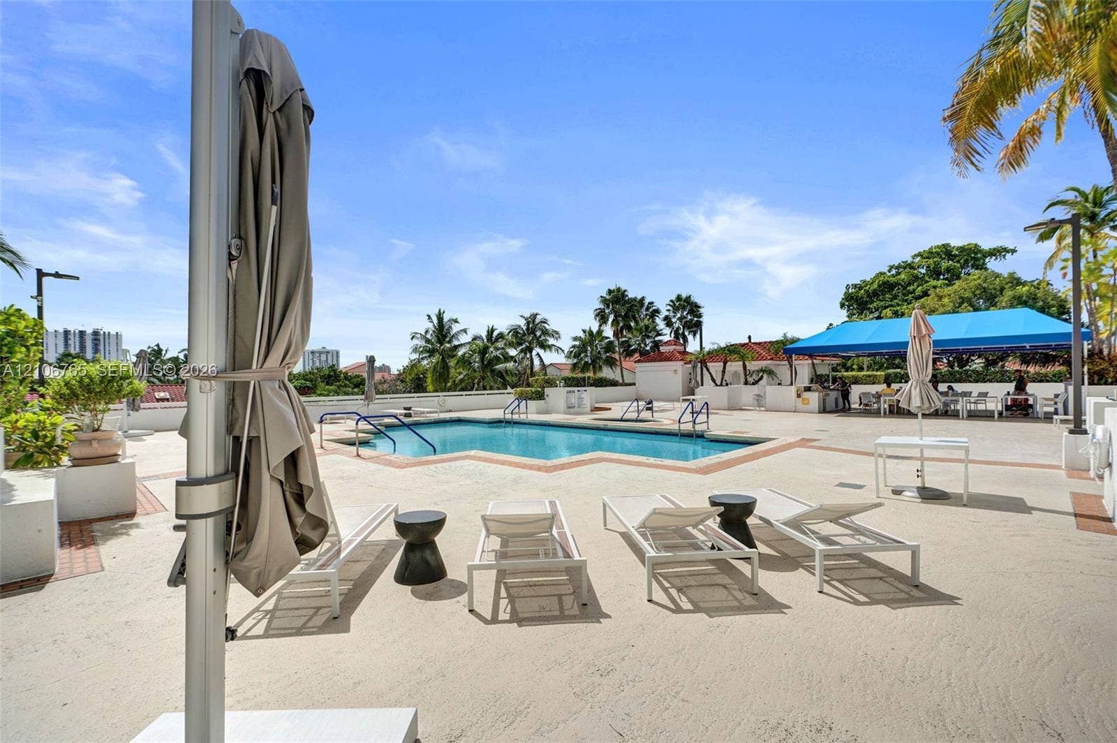 3598 Yacht Club Drive, #901, Aventura, FL 33180 Swimming pool, expansive concrete deck, built-in structural shaded area, and perimeter masonry walls