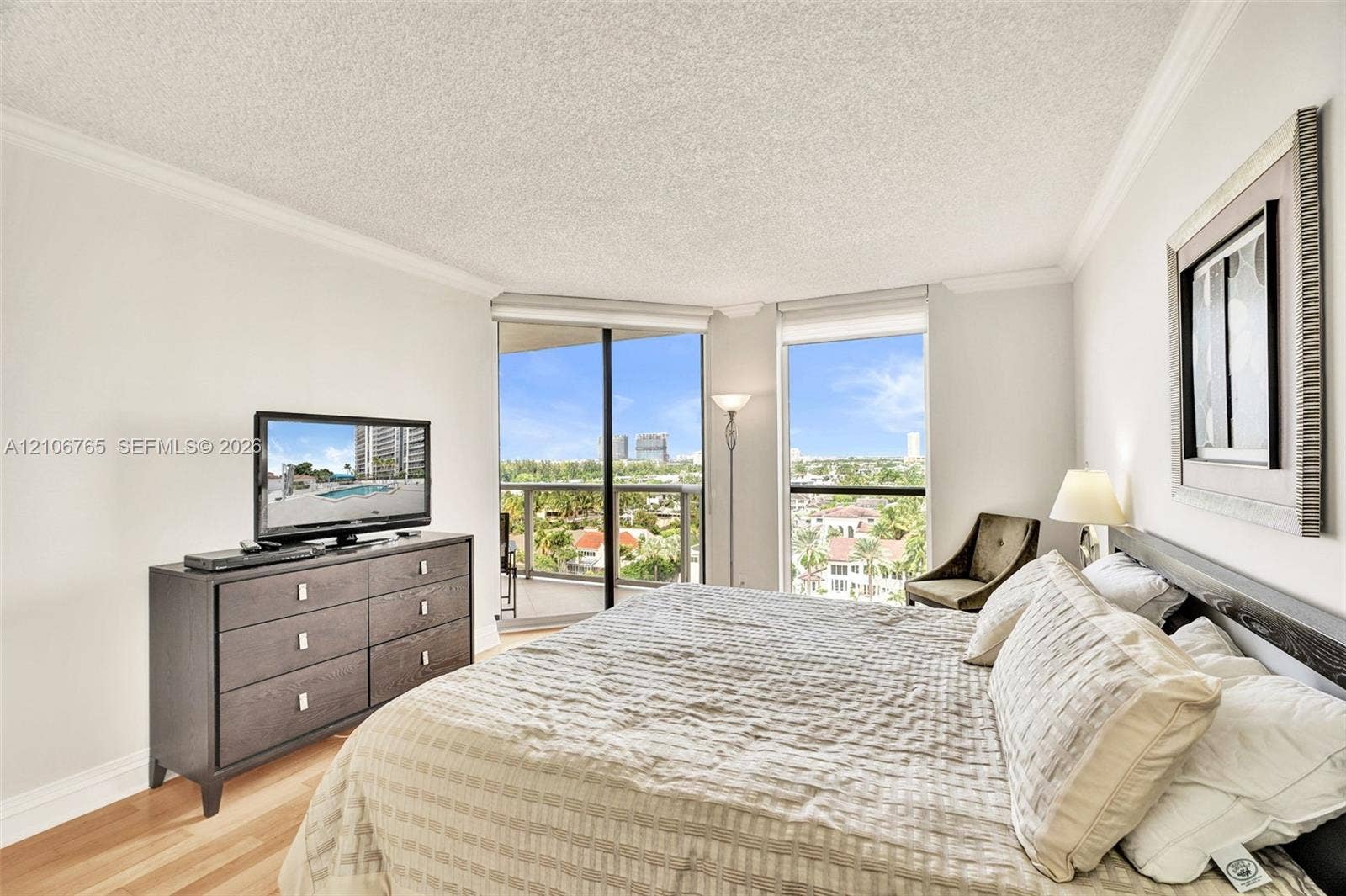 3598 Yacht Club Drive, #901, Aventura, FL 33180 Floor-to-ceiling windows, sliding glass door, private balcony, wood floors.