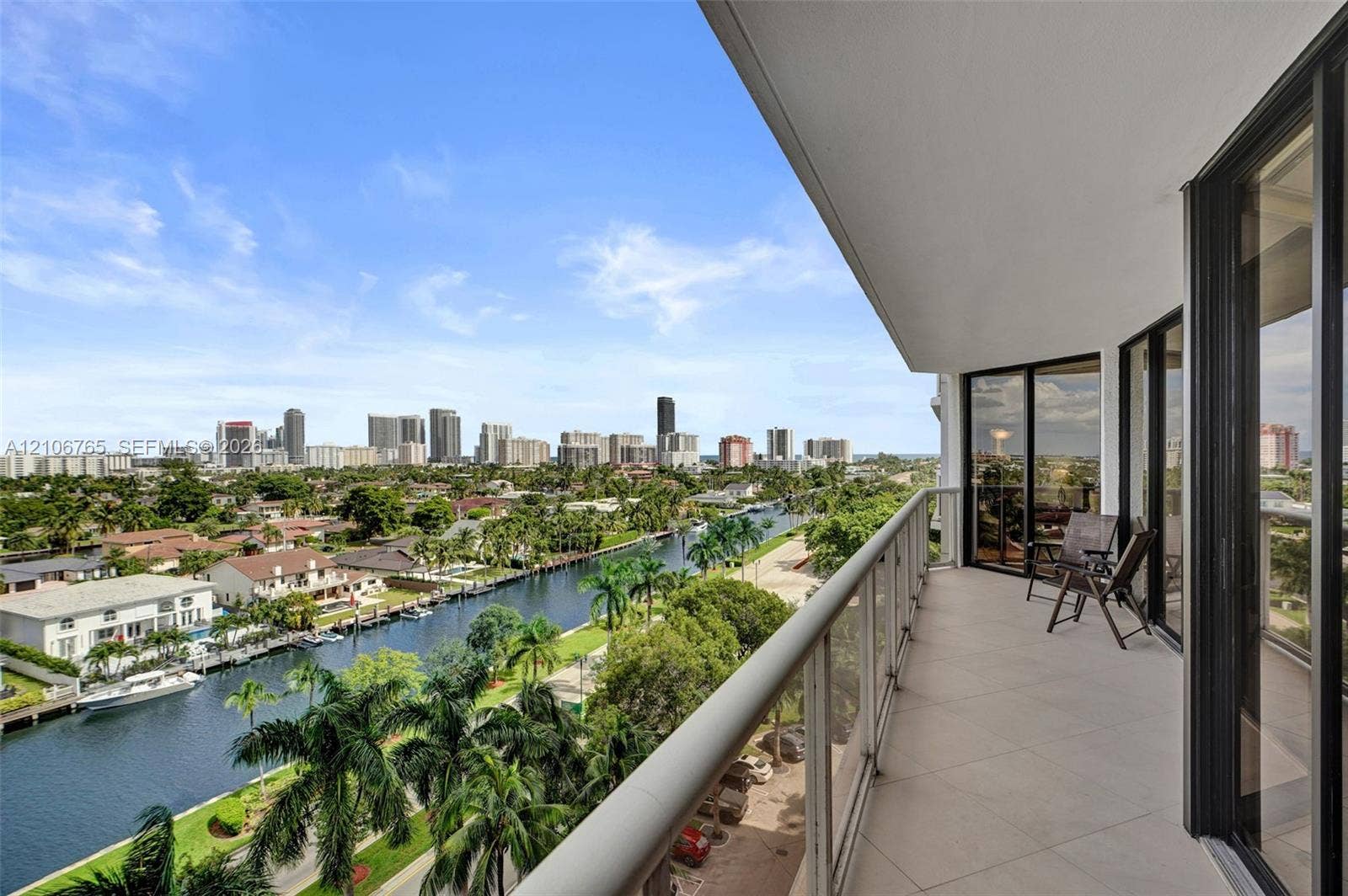 3598 Yacht Club Drive, #901, Aventura, FL 33180 Covered balcony, overlooking the canal and urban skyline.