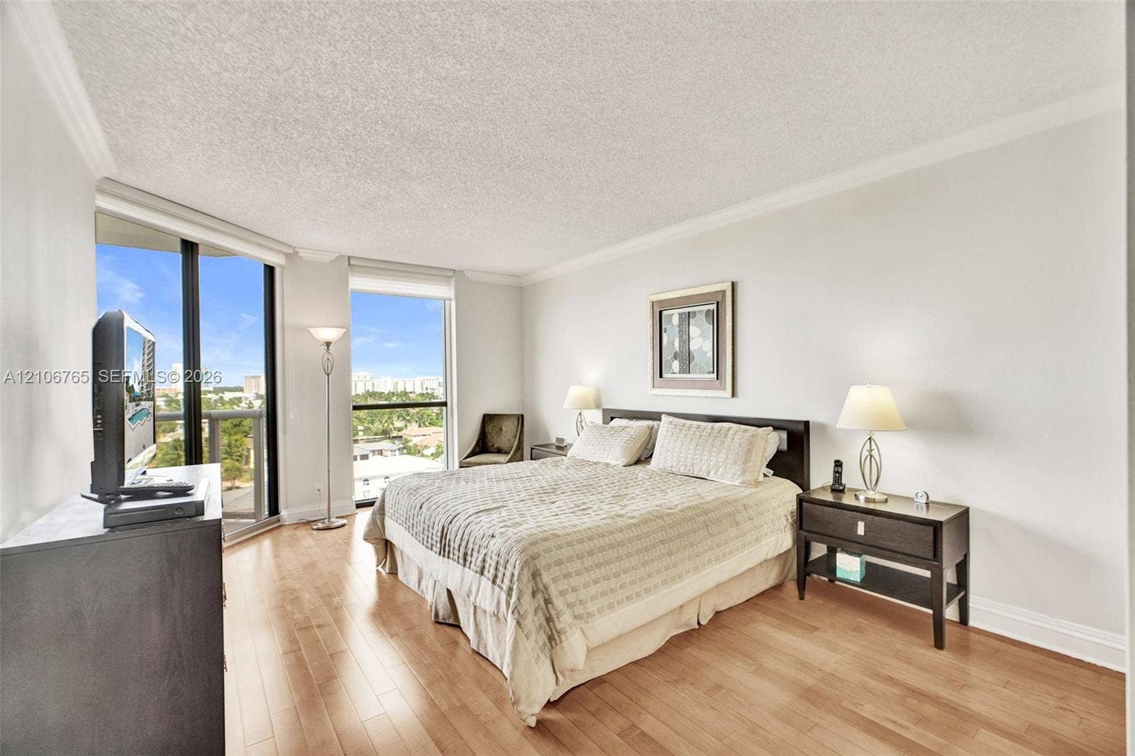 3598 Yacht Club Drive, #901, Aventura, FL 33180 Main bedroom. wood floors, floor-to-ceiling windows.