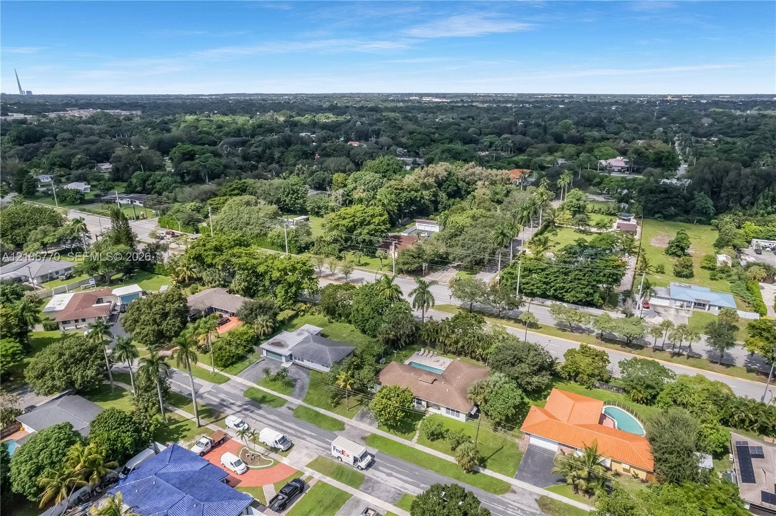 5701 SW 1st Street, Plantation, FL 33317 Aerial perspective of a residential neighborhood featuring mature canopy trees, varied housing styles, established paved streets, and residential swimming pools