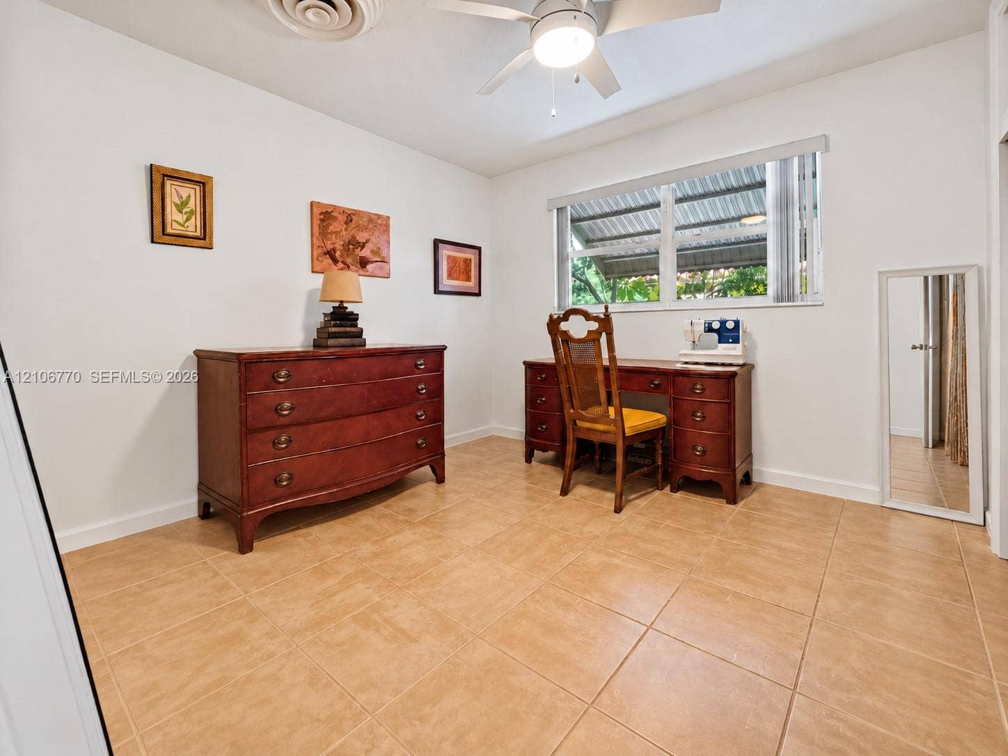 5701 SW 1st Street, Plantation, FL 33317 Room featuring neutral walls, large-format tile flooring, a ceiling fan with integrated lighting, and a horizontal window with adjustable blinds