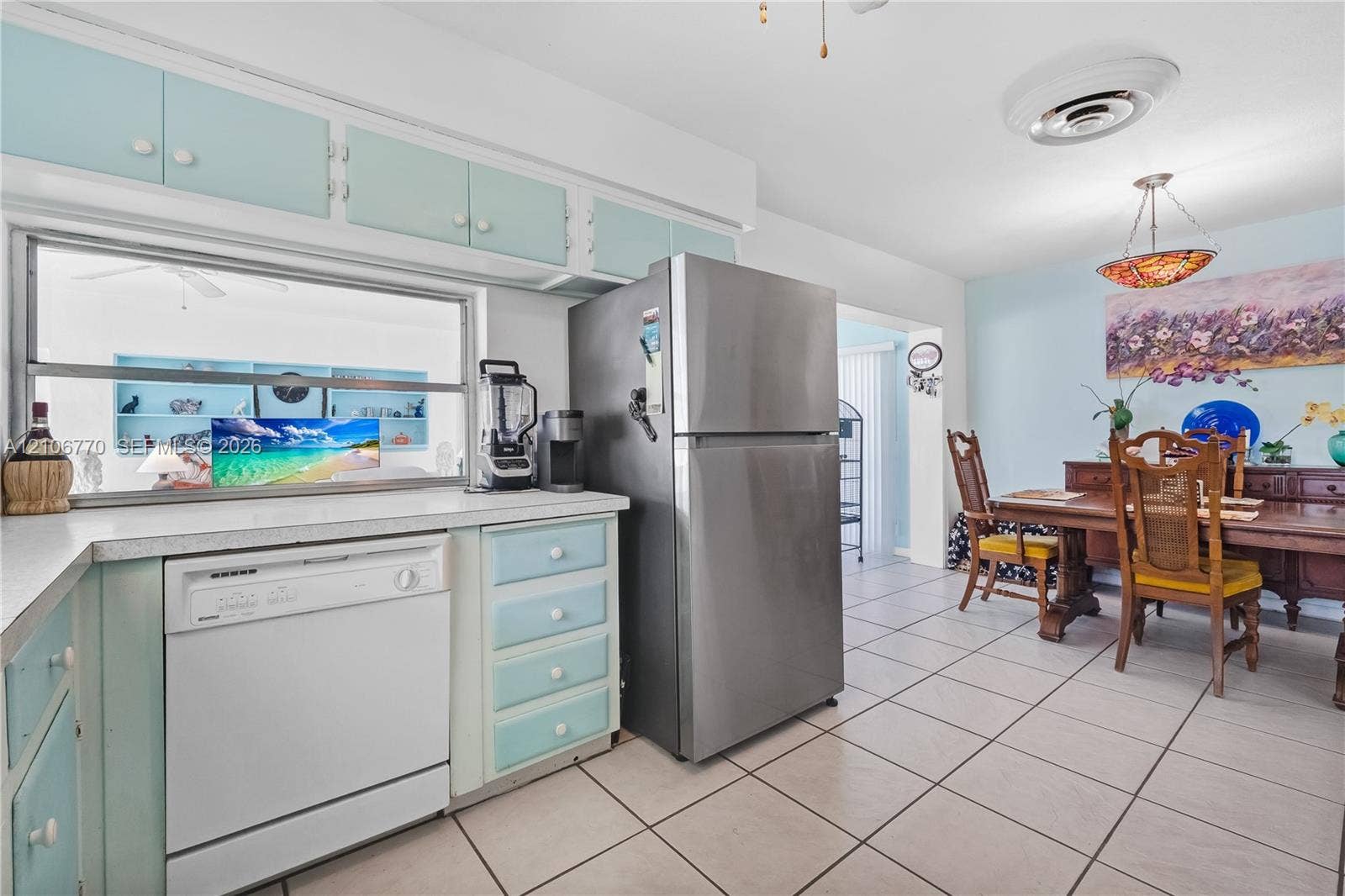 5701 SW 1st Street, Plantation, FL 33317 Kitchen featuring custom cabinetry, stainless steel refrigerator, white dishwasher, and tile flooring