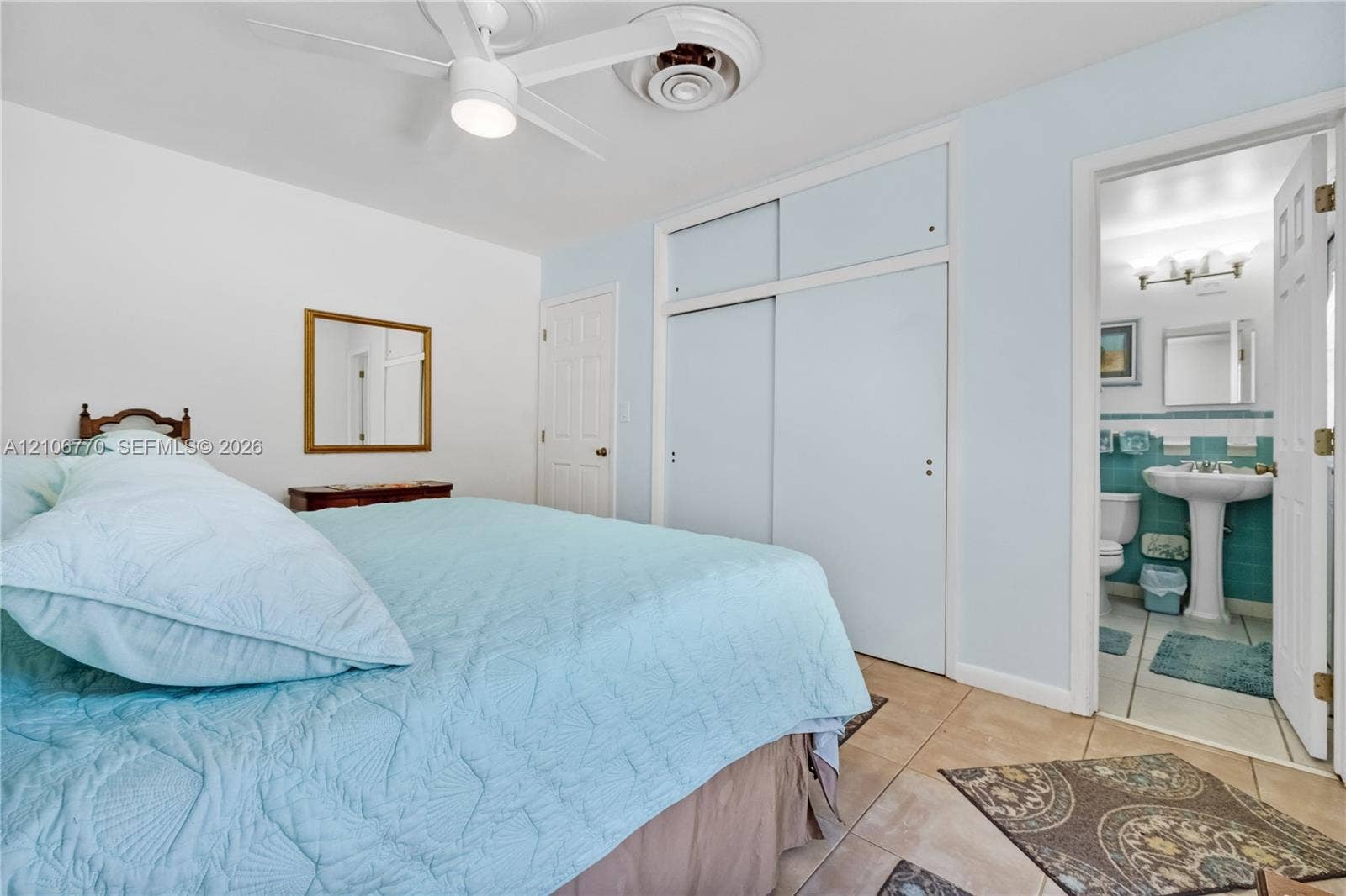 5701 SW 1st Street, Plantation, FL 33317 Interior space featuring tile flooring, ceiling fan with integrated lighting, and floor-to-ceiling sliding closet doors