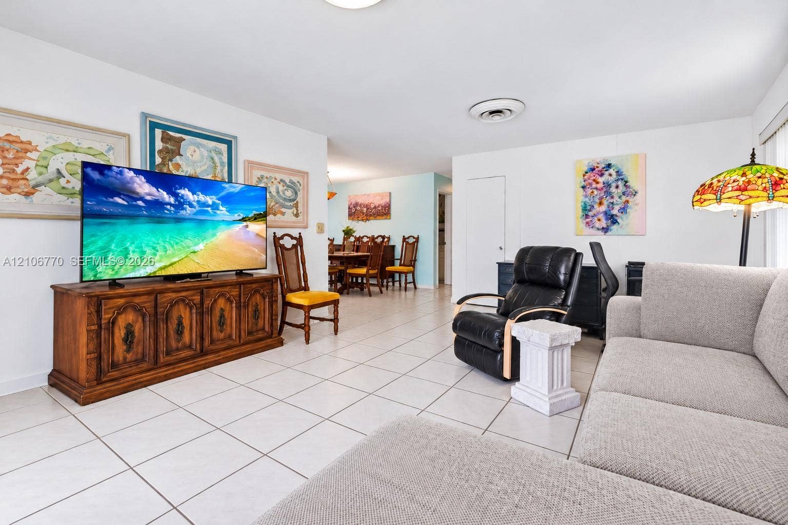 5701 SW 1st Street, Plantation, FL 33317 Open-concept interior featuring light-toned tile flooring and recessed ceiling lighting