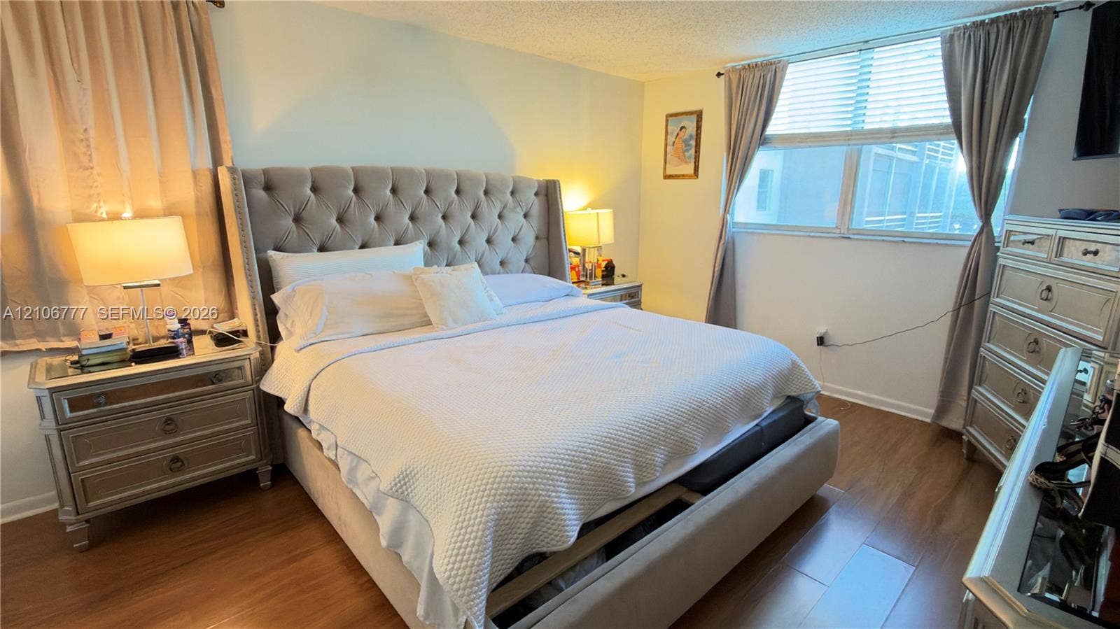 1810 SW 81st Avenue, #2200, North Lauderdale, North Lauderdale, FL 33068 Wood-finish flooring, textured ceiling, and a large multi-pane window with horizontal blinds
