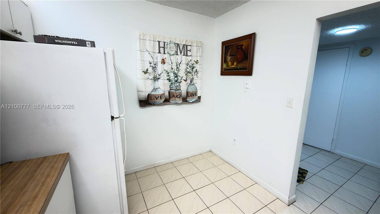 1810 SW 81st Avenue, #2200, North Lauderdale, North Lauderdale, FL 33068 Kitchen featuring white cabinetry, wood-finish countertops, and ceramic tile flooring