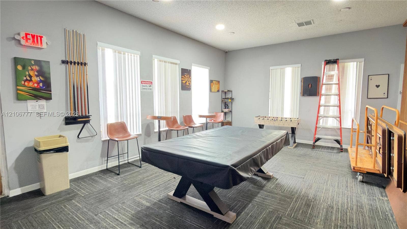 1810 SW 81st Avenue, #2200, North Lauderdale, North Lauderdale, FL 33068 Spacious room featuring neutral wall paint, carpet tile flooring, and multiple windows with vertical blinds