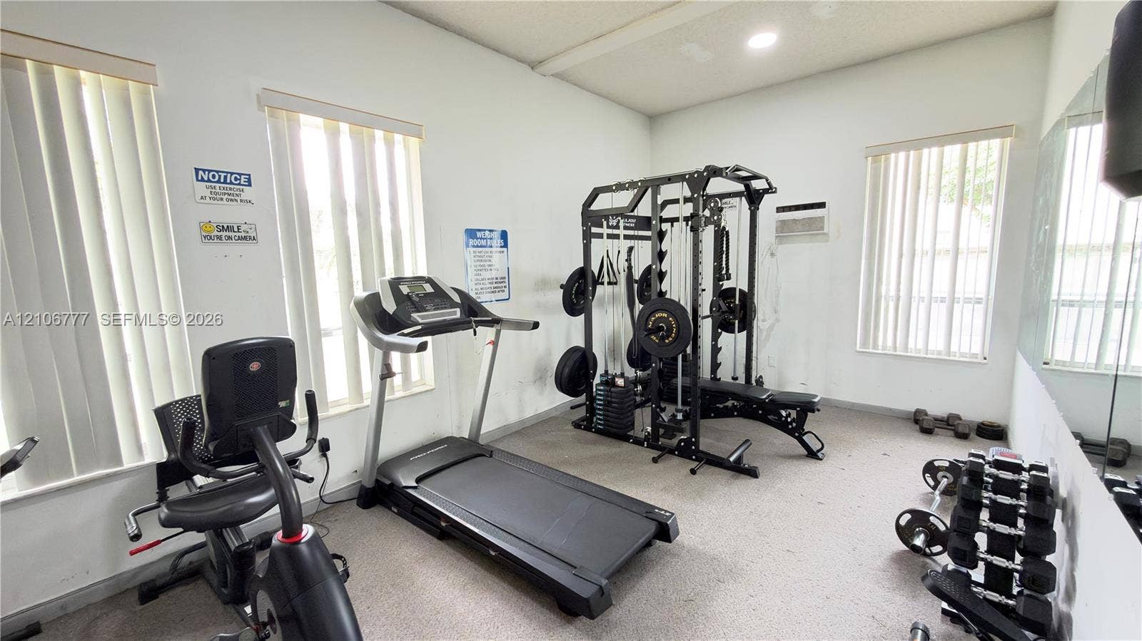 1810 SW 81st Avenue, #2200, North Lauderdale, North Lauderdale, FL 33068 Fitness space featuring wall-to-wall mirrors, recessed lighting, and vertical blinds