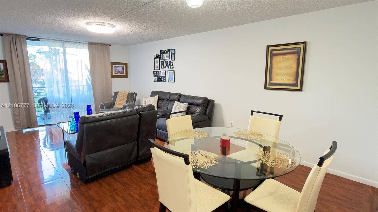 1810 SW 81st Avenue, #2200, North Lauderdale, North Lauderdale, FL 33068 Open-concept living space featuring wood-finish flooring, flush-mount ceiling lighting, and floor-to-ceiling sliding glass doors
