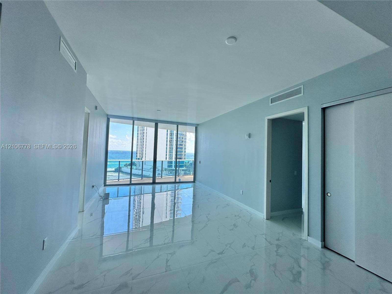 17550 Collins Avenue, #803, Sunny Isles Beach, Sunny Isles Beach, FL 33160 Floor-to-ceiling glass windows, polished stone-finish flooring, sliding door closet, and recessed lighting