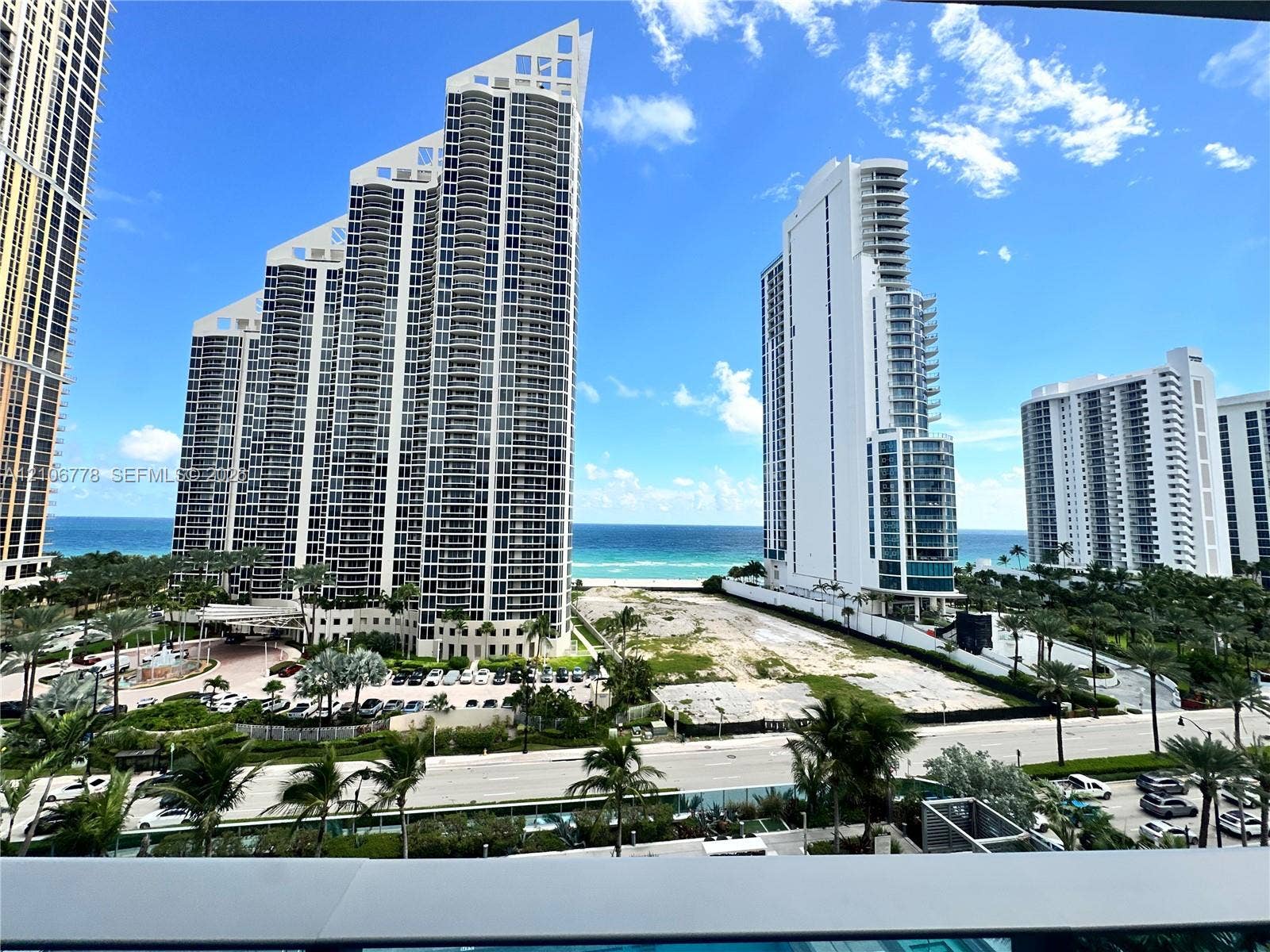 17550 Collins Avenue, #803, Sunny Isles Beach, Sunny Isles Beach, FL 33160 Ocean scenery with multiple high-rise buildings and a palm-lined street