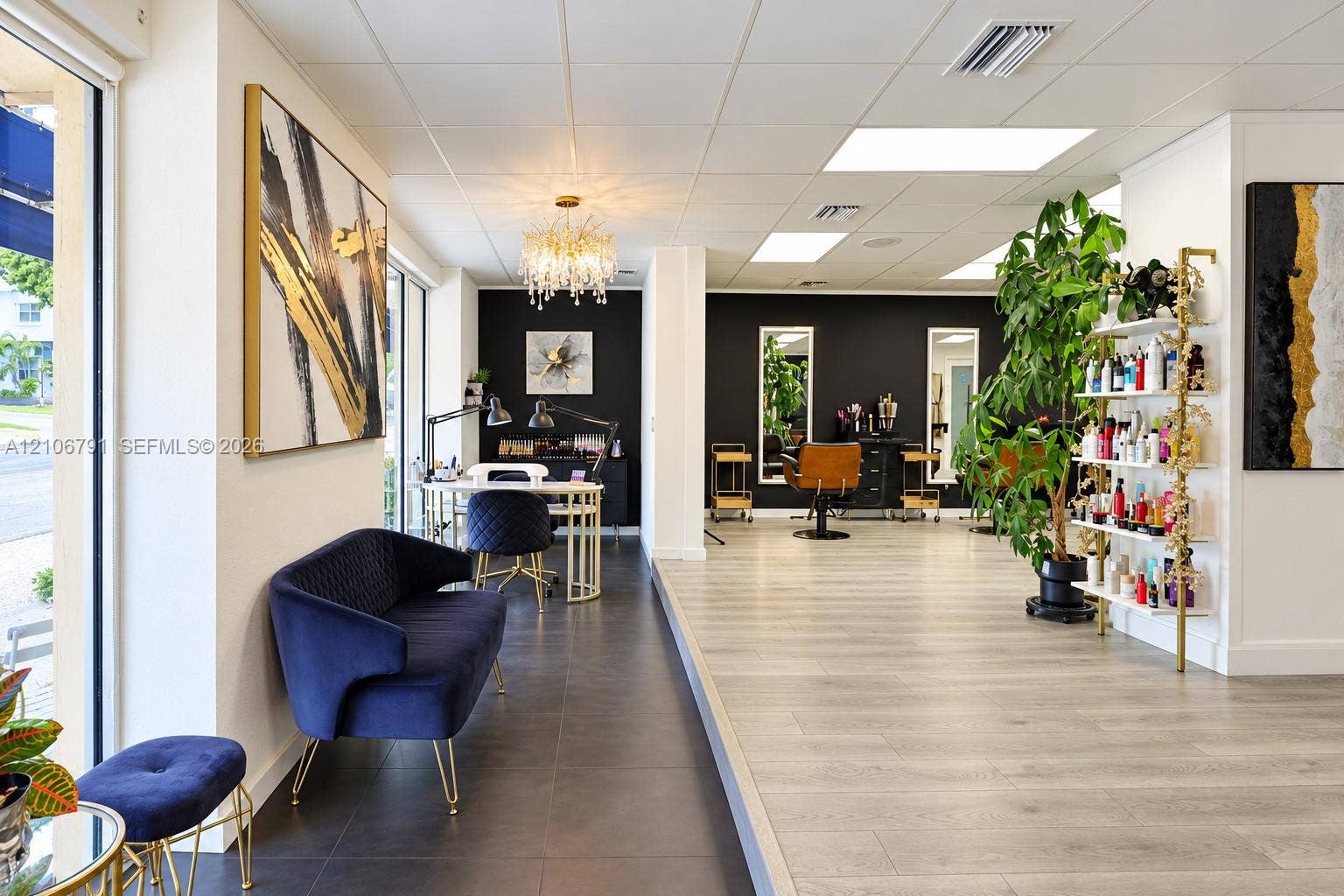 1684 SE 10th Avenue, Fort Lauderdale, Fort Lauderdale, FL 33316 Open-concept commercial space featuring wood-finish flooring, large-format tile flooring, recessed ceiling lighting, and a crystal chandelier