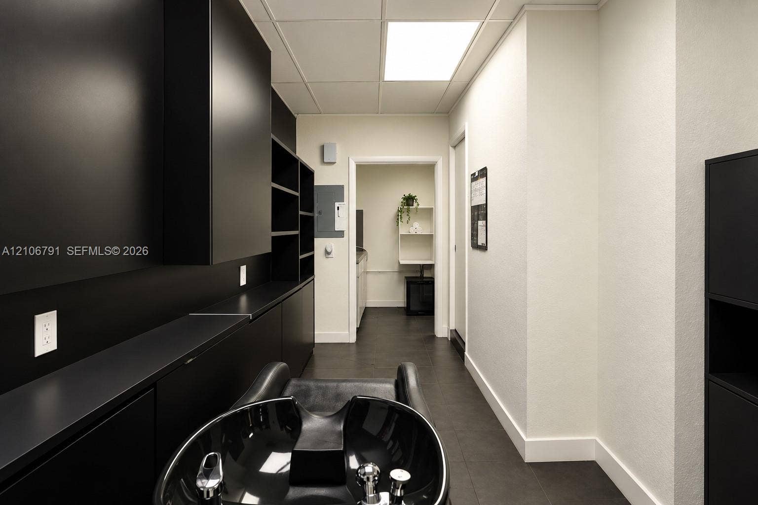 1684 SE 10th Avenue, Fort Lauderdale, Fort Lauderdale, FL 33316 Matte black built-in cabinetry, dark-finish tile flooring, recessed square ceiling lighting, and a black ceramic basin with chrome fixtures