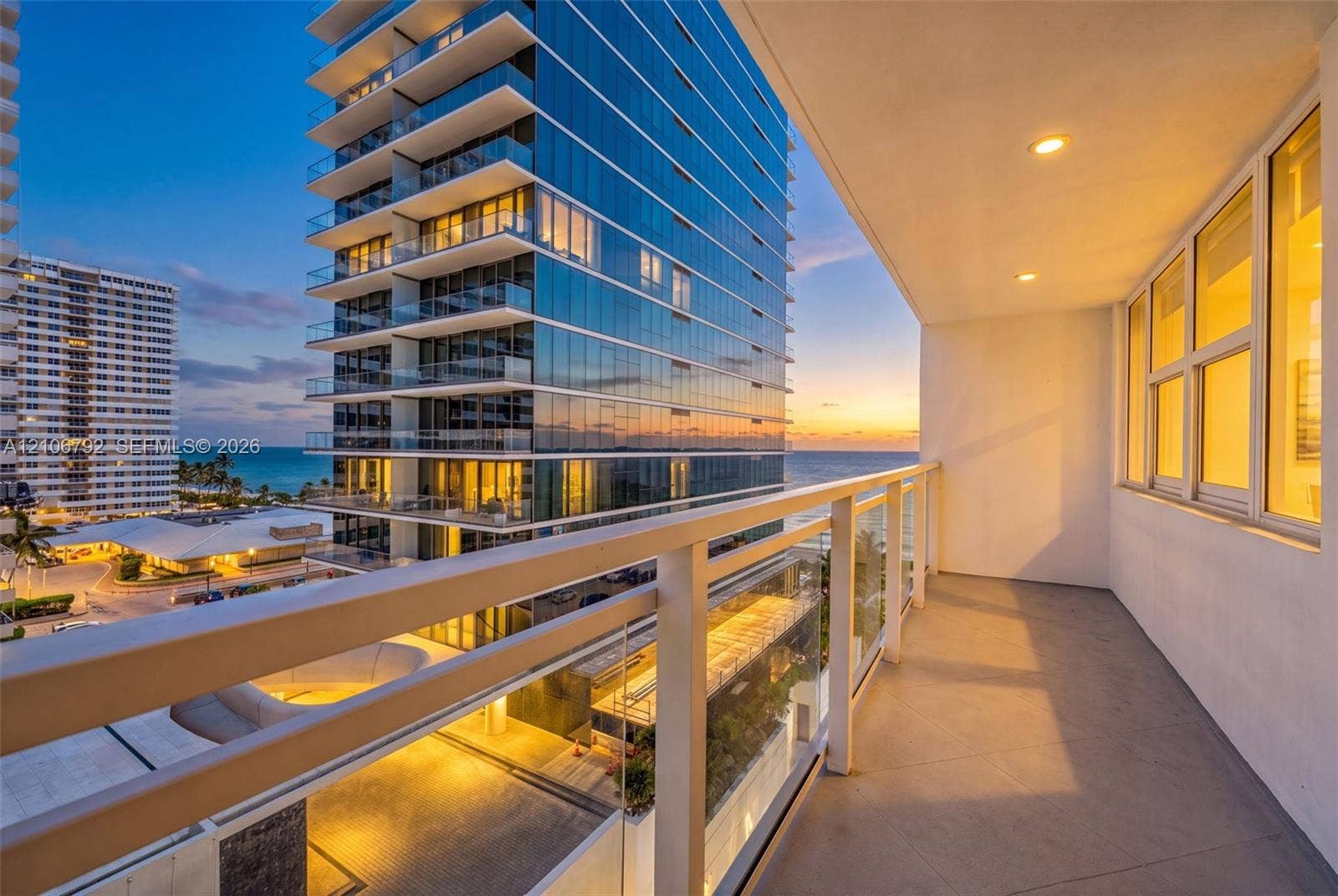 2030 S Ocean Drive, #723, Hallandale Beach, FL 33009 Covered balcony featuring a glass and metal railing system, recessed lighting, and tile flooring
