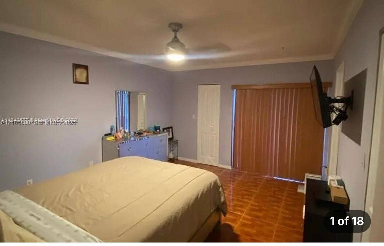 3820 SW 52nd Avenue, Hollywood, Hollywood, FL 33023 Interior room featuring ceramic tile flooring, a ceiling fan, and vertical blinds covering the door