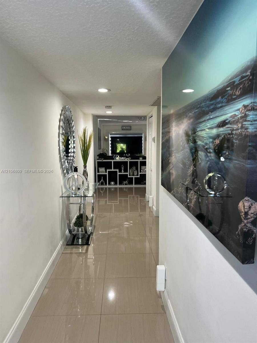 12600 SW 5th Court, #204L, Pembroke Pines, FL 33027 Hallway featuring polished tile flooring and recessed lighting