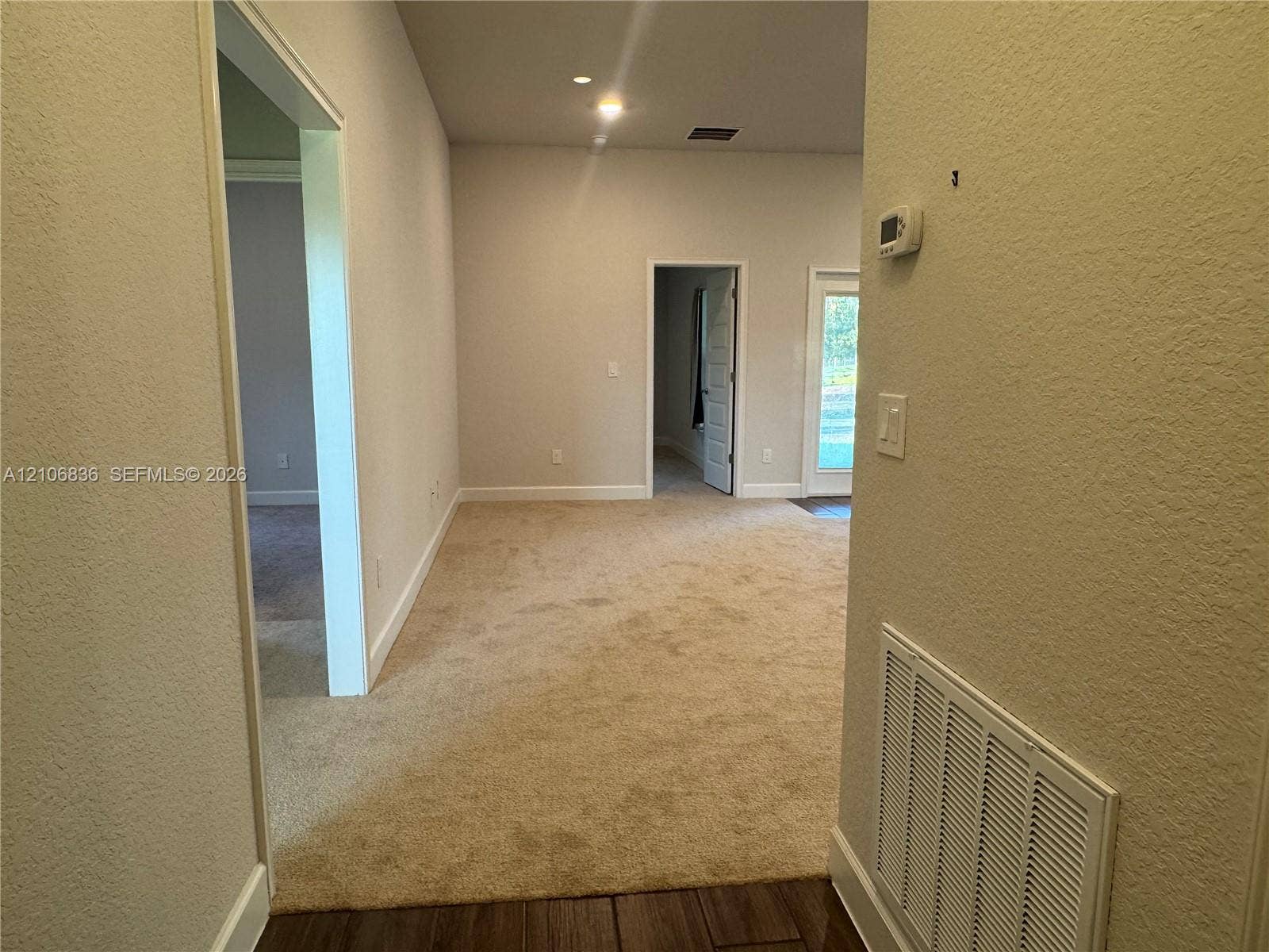 187 NW 45th Loop, Ocala, FL 34475 Neutral wall tones, carpeted flooring, recessed lighting, and interior passage doors