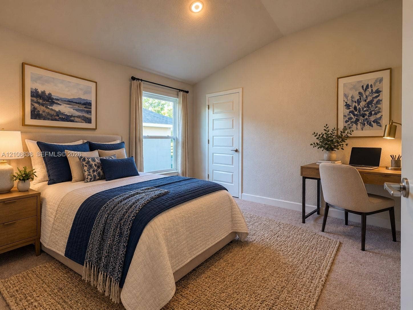 187 NW 45th Loop, Ocala, FL 34475 Vaulted ceiling featuring a recessed light fixture, neutral wall finishes, single-panel interior door, and window with casing