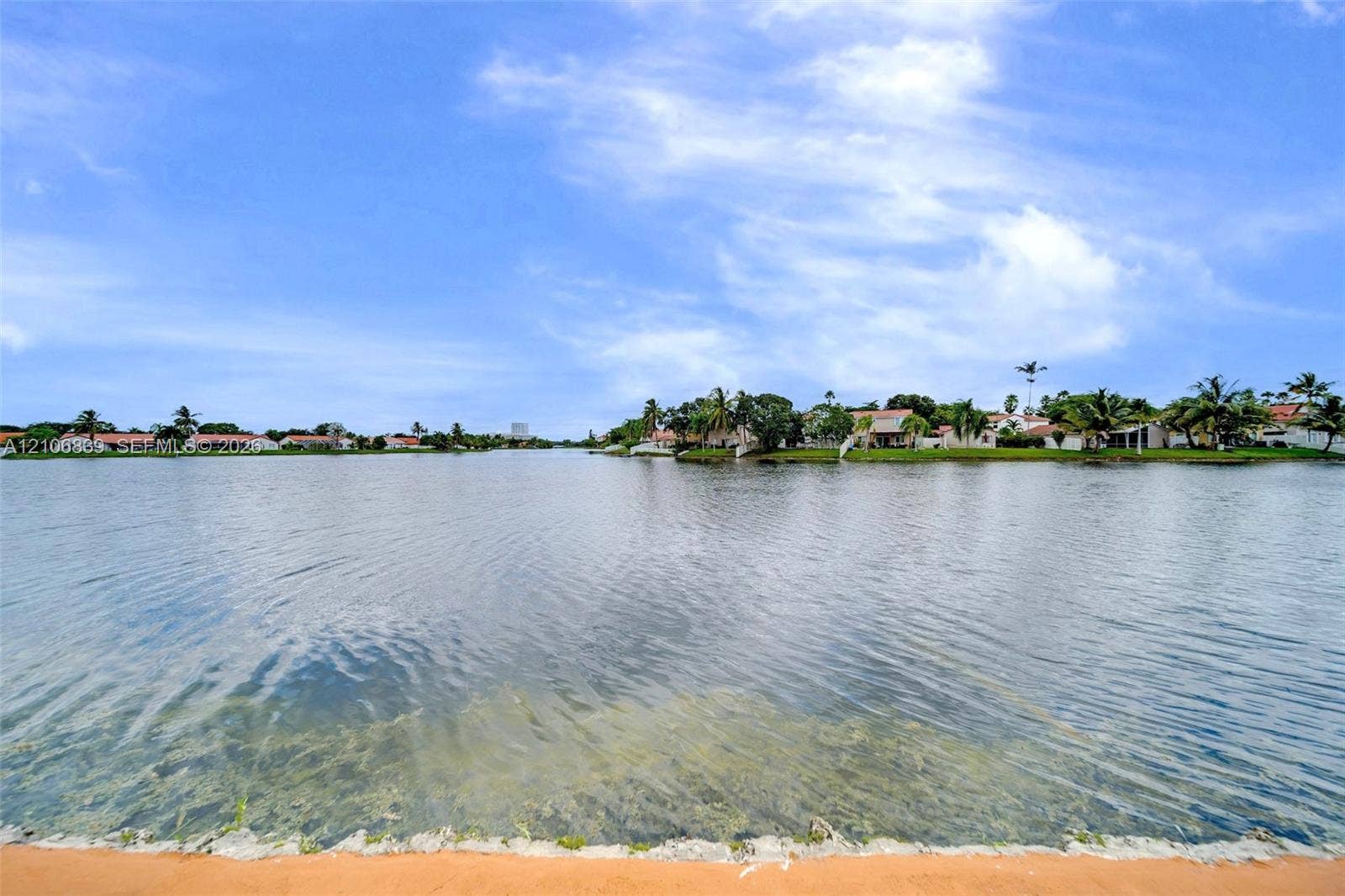12683 NW 11th Place, Sunrise, FL 33323 Waterfront lot featuring a stone-reinforced shoreline and expansive water frontage